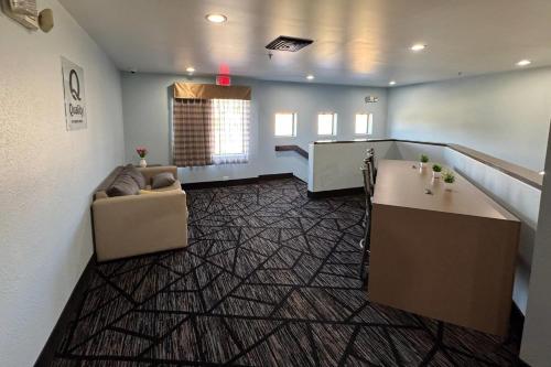 a living room with a couch and a table at Quality Inn in Lavonia
