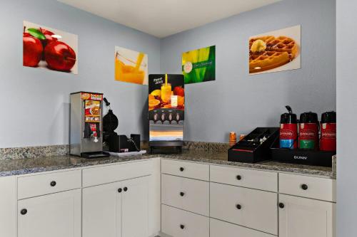 a kitchen with a counter top with a coffee maker at Quality Inn in Lavonia