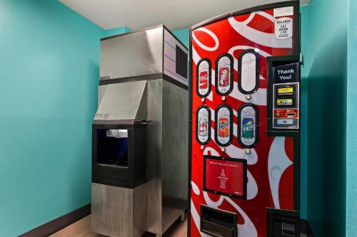 a coca cola vending machine next to a soda machine at Quality Inn in Lavonia