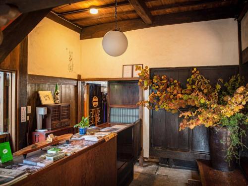 a kitchen with a long counter with a plant at KuuHouse - Vacation STAY 84430 in Ichikawamisato