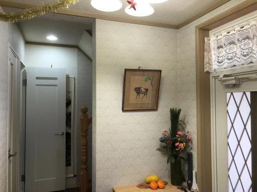a room with a table and a picture on the wall at Kamogawa - House - Vacation STAY 9979 in Kamogawa