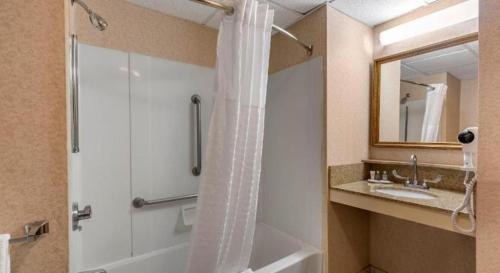 a bathroom with a shower and a sink at Comfort Inn Foxboro - Mansfield in Foxborough