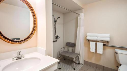 a bathroom with a sink and a mirror at Best Western Plus Twin View Inn and Suites in Redding
