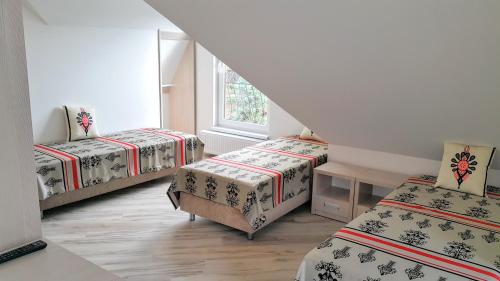 Ένα ή περισσότερα κρεβάτια σε δωμάτιο στο Residence Spa Harenda