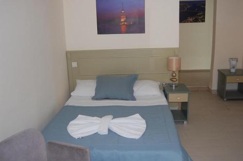Postel nebo postele na pokoji v ubytování Golden Age Hotel Yalıkavak Bodrum