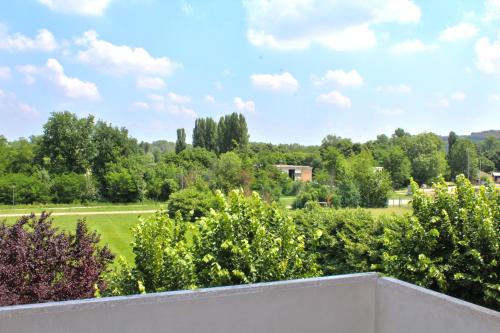 a view of a park from the balcony of a house at Park Hotel in Castrocaro Terme