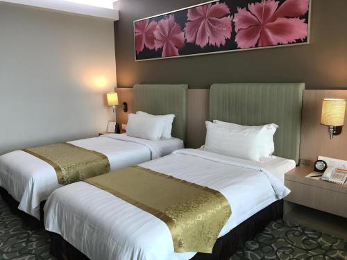 Ένα ή περισσότερα κρεβάτια σε δωμάτιο στο Hotel AIFA