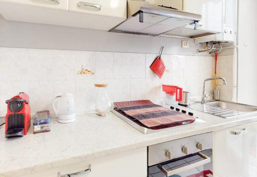 a kitchen with a counter top with a sink at Como Lake Palanzone-Appartamento in Castelmarte