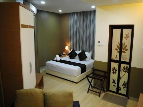 Katil atau katil-katil dalam bilik di Hotel Kobemas Melaka