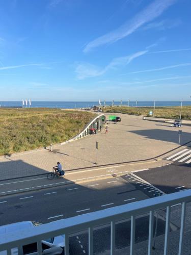 a view of a parking lot with the ocean in the background at Blvd 79 in Katwijk aan Zee