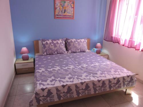 Postel nebo postele na pokoji v ubytování Apartments Vera