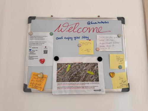 a white refrigerator with a welcome sign on it at Ferienwohnung Hubertus in Blankenstein