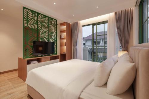 Postel nebo postele na pokoji v ubytování Sea Gallery Tropical Villa Private Pool Khem Beach Phu Quoc