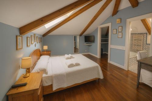 a bedroom with a bed with two towels on it at The Secret Garden Relais in Piano di Sorrento