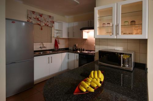 a kitchen with a bunch of bananas on a counter at Clarens Cottage 2 in Clarens