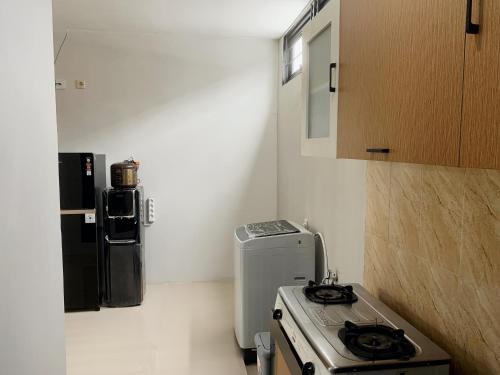 Η κουζίνα ή μικρή κουζίνα στο Shakilla House 8B Syariah Panorama