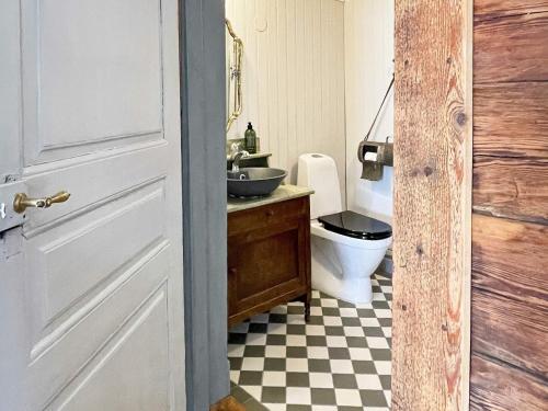 a bathroom with a sink and a toilet at 4 person holiday home in FURUBY in Furuby