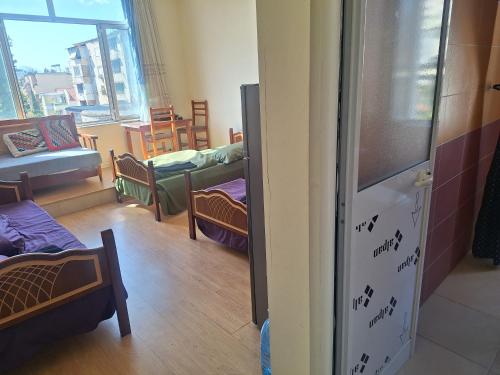 Ένα ή περισσότερα κρεβάτια σε δωμάτιο στο Rowdy Guest House