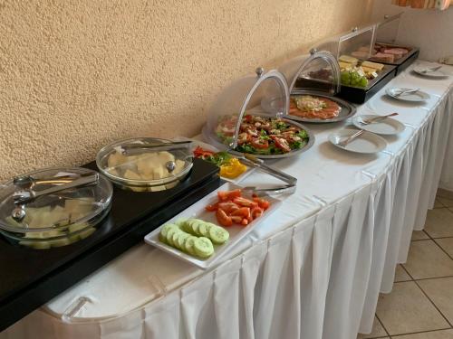 a buffet line with different types of food on it at Pension Ritzer in Pleinfeld