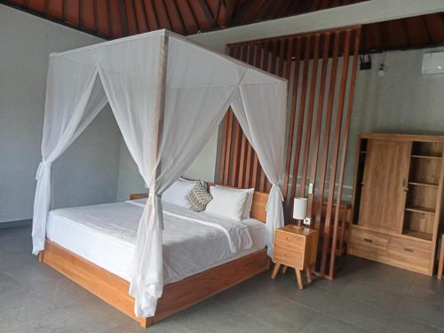 Katil atau katil-katil dalam bilik di Tumbu Retreat