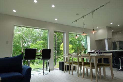 a kitchen and dining room with a table and chairs at CLOUD9 - Vacation STAY 45821v in Rusutsu