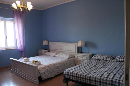 Postel nebo postele na pokoji v ubytování Alle Preci Country house