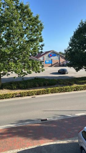 a view of a street with a building in the background at MonteurGut Apartments Kastanie in Marren