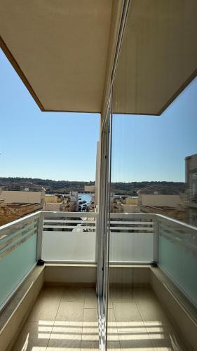 a view from the balcony of a building at Seabreeze Marsaxlokk Apartment in Marsaxlokk