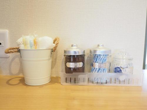 a counter with a container of toothbrushes and a cup of toothpaste at Harbour Inn & Suites - Vacation STAY 8829 in Niigata