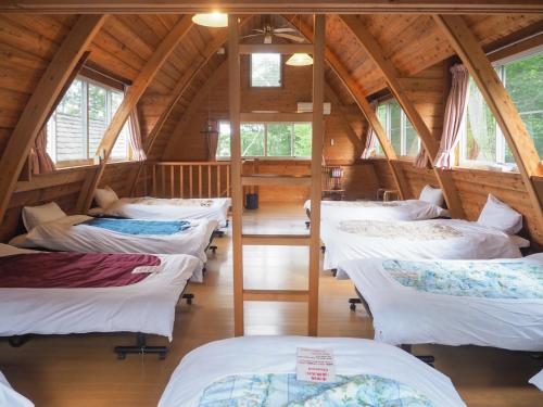 a group of beds in a room in a cabin at Nasu-gun - House - Vacation STAY 9032 in Anazawa