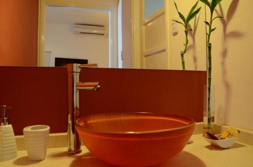 Ett badrum på Toscano Hotel