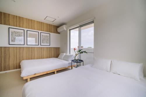 a bedroom with two beds and a window at 257-1 - Vacation STAY 91246 in Jima