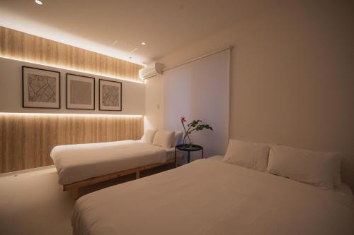a bedroom with two beds and a window at 257-1 - Vacation STAY 91246 in Jima