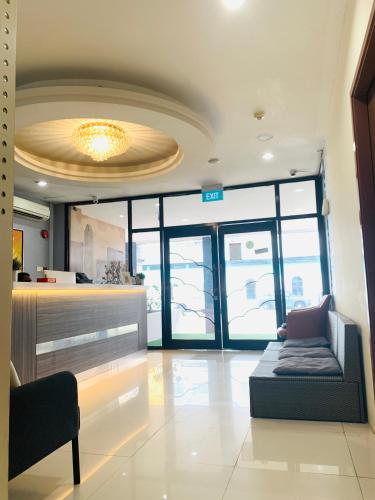 a lobby with a couch in the middle of a room at Hi Hotel Dot in Singapore