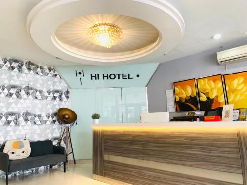 a lobby of a hilton hotel with a chandelier at Hi Hotel Dot in Singapore