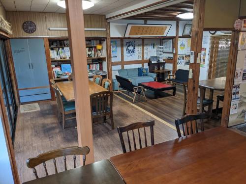 a restaurant with tables and chairs in a room at guest house Ki-zu - Vacation STAY 94978v in Nishio