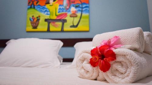 Una cama o camas en una habitación de Pousada Só Alegria