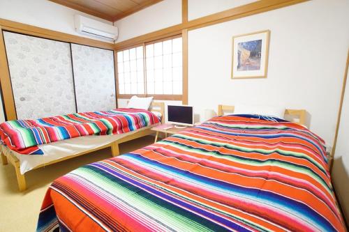 Katil atau katil-katil dalam bilik di Takamatsu Guest House Akane - Vacation STAY 83061v