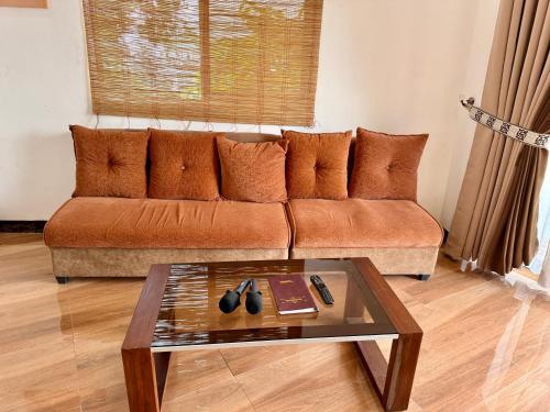 a living room with a couch and a coffee table at Entire Home in Pampanga in San Fernando