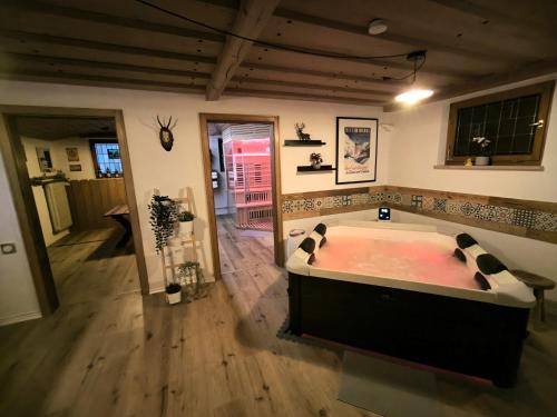 a large room with a large tub in a room at Haus Blindauer Eck in Reit im Winkl