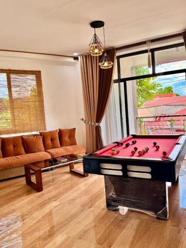 a living room with a pool table in it at Entire Home in Pampanga in San Fernando