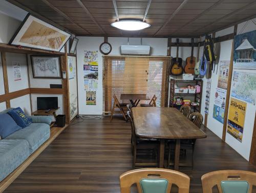 a living room with a table and a couch at guest house Ki-zu - Vacation STAY 95389v in Nishio