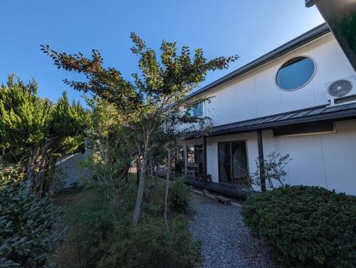 a small tree in front of a house at guest house Ki-zu - Vacation STAY 95389v in Nishio