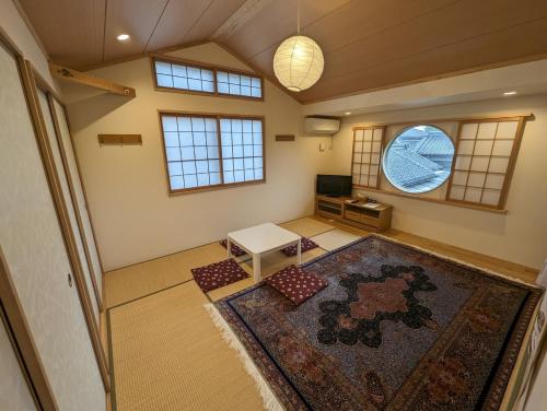 an overhead view of a living room with a rug at guest house Ki-zu - Vacation STAY 96116v in Nishio