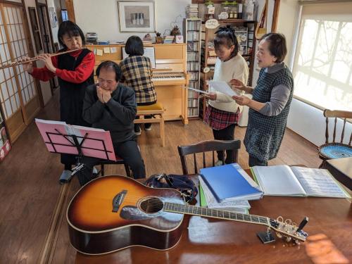 a group of people standing in a room with a guitar at guest house Ki-zu - Vacation STAY 96116v in Nishio