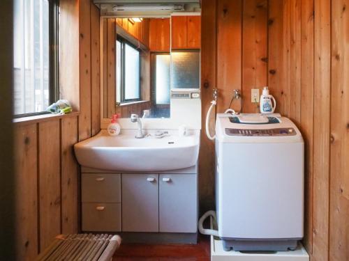 a small bathroom with a sink and a washing machine at Nakagawa Bettei - Vacation STAY 9303 in Otawara