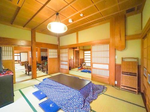 a living room with a table in the middle of it at Nakagawa Bettei - Vacation STAY 9303 in Otawara