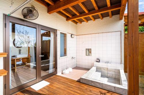 a large bathroom with a shower and a tub at Me-fi-You Ishigaki Island - Vacation STAY 95379 in Ishigaki Island