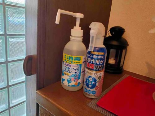 two bottles of cleaner sitting on top of a counter at west crab base - Vacation STAY 13480 in Hiroshima