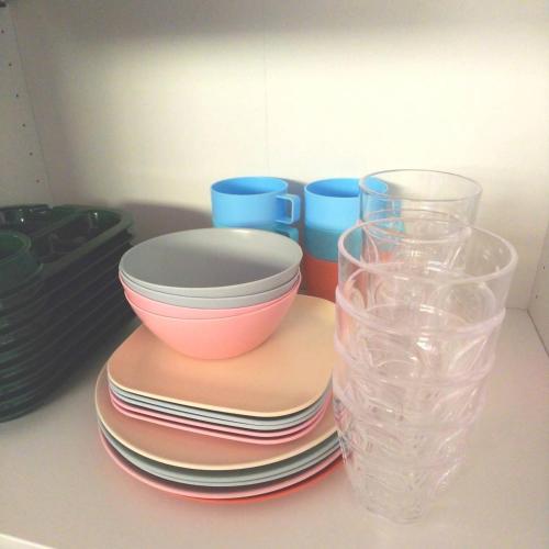 a stack of plates and bowls and glasses on a counter at Villa Chillon - Vacation STAY 97710 in Sakate